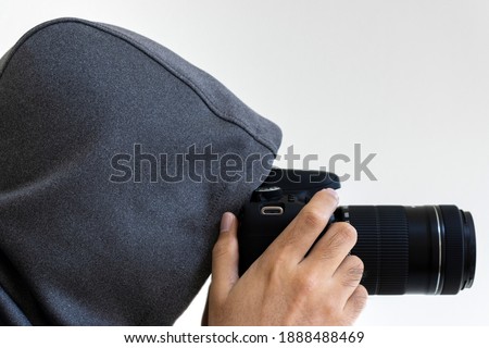 Image of a man taking a voyeur Royalty-Free Stock Photo #1888488469