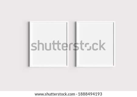 Set of two white portrait picture frame mockups