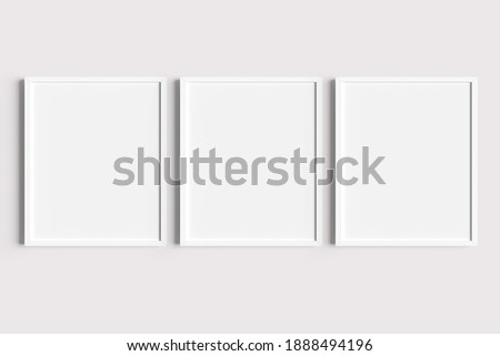 Set of three white portrait picture frame mockups Royalty-Free Stock Photo #1888494196