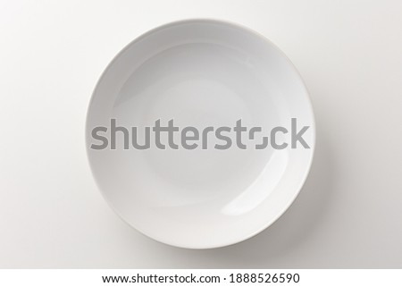 Top view White empty plates on a white table. Household equipment Royalty-Free Stock Photo #1888526590