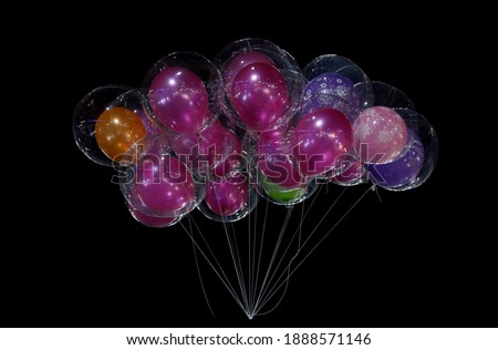 Beautiful colorful balloon with gas on black background texture