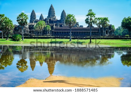 Here is a picture in front of Angkor Wat with a nice clear pond, Amret water, which before the king always bathed in this pond