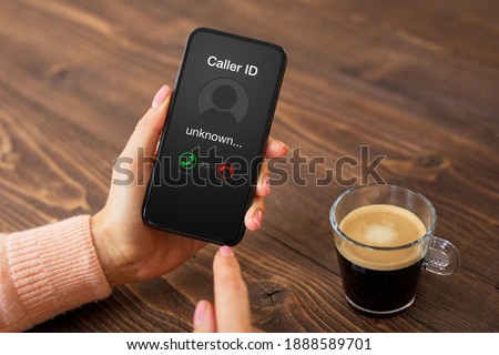 Person receiving a call from an unknown caller Royalty-Free Stock Photo #1888589701