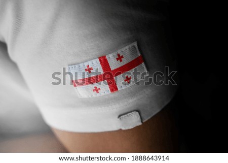 Patch of the national flag of the Georgia on a white t-shirt