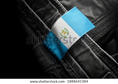 Tag on dark clothing in the form of the flag of the Guatemala