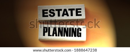 Estate planning words on wooden blocks on yellow. Real esate business concept.