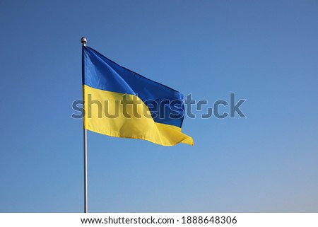 National flag of Ukraine against blue sky Royalty-Free Stock Photo #1888648306
