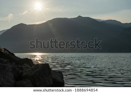view of lake iseo and mountains at sunrise