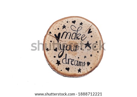 make your dream - inspirational phrase on wood, handwriting. Isolated on white