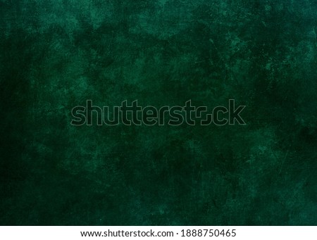 Dark green grungy background or texture 
