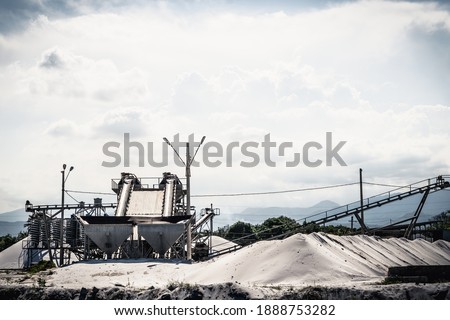 Sand stone crush process refinery operating conveyor belt mining terminal factory wash lift manufacture desert. Concept build material, abandoned or hidden production industrial threat. Sky cumulus
