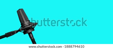 Professional microphone isolated on blue background, radio, podcast or website banner with copy space Royalty-Free Stock Photo #1888794610