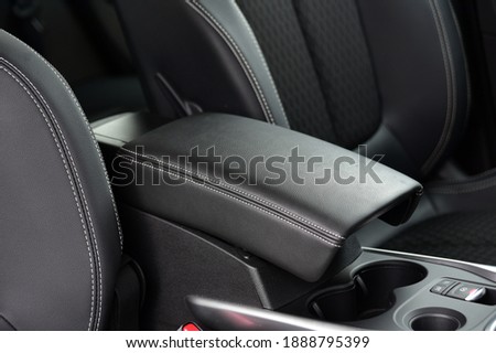 Armrest in the luxury passenger car between the front seats Royalty-Free Stock Photo #1888795399