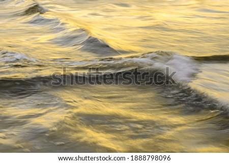 Motion blur abstract water background in trendy colors 2021. Gray and Yellow