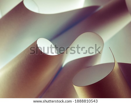 a macro, abstract, background picture of white sheets of paper, wavy, twisted, curved shapes.