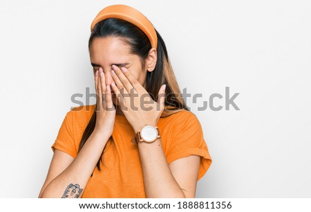 Young hispanic woman wearing casual clothes rubbing eyes for fatigue and headache, sleepy and tired expression. vision problem 