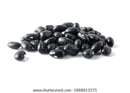 Black beans isolated on white background. Black beans are rich in a certain mineral and soluble fiber. Soluble fiber may help prevent heart disease by balancing unhealthy cholesterol levels. Royalty-Free Stock Photo #1888813375