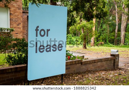 For lease sign on a blue display outside of a resedential building in Australia