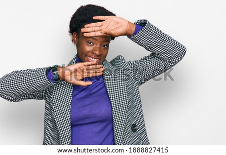 Young african american girl wearing casual clothes smiling cheerful playing peek a boo with hands showing face. surprised and exited 