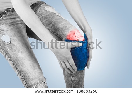 Cool gel pack on a swollen hurting knee. Medical concept photo. 