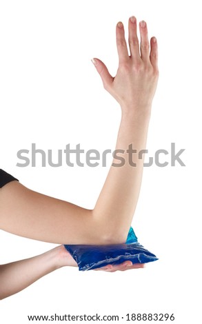 Woman holding ice gel pack on elbow. Medical concept photo. 