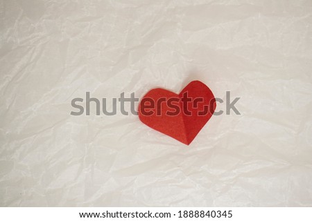 heart on crumpled paper. cards for valentines day on white crumpled background with copy space