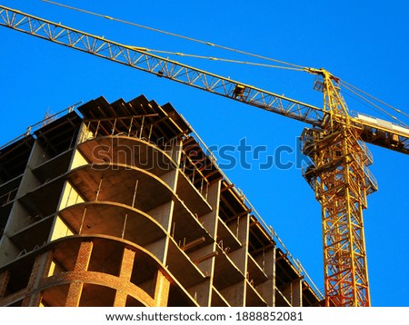 Construction site. Crane near building. Industrial backhround.