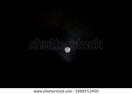 Full moon on the black sky background.