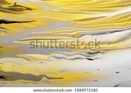 Trending colors of 2021. Gray, yellow and black waves flow. Marble effect background or texture. Fluid Art.