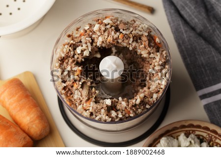 Ground meat, offal, carrots - natural food for cats or dogs  Royalty-Free Stock Photo #1889002468