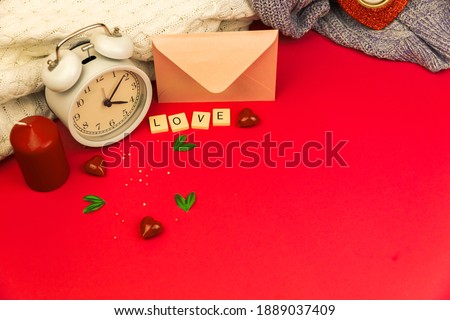 Be my greeting card, theme of love, february Valentine's day with decoration, love word on cubes, copy space and knintted sweaters photo