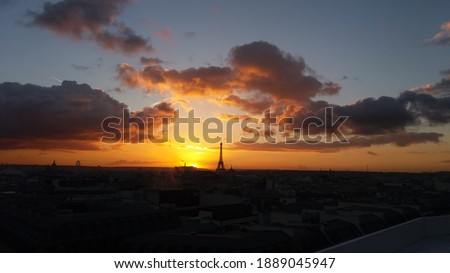 sunset in paris with view on the eiffel tower