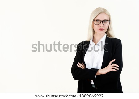 Portrait business woman wearing glasses and a jacket on a white background. Crossed arms.