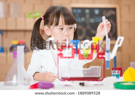 young  girl  play science experiments for homeschooling 