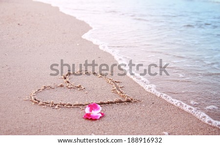 a heart in the sand on the seashore 
