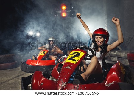 girl is driving Go-kart with speed in Karting   Royalty-Free Stock Photo #188918696
