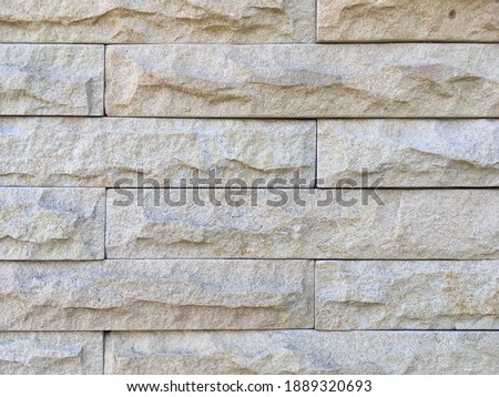 Sand stone mosaic wall texture pattern background 