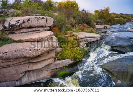 A small fast waterfall Kamenka in the wilderness in the evening light in Ukraine.