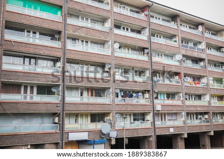 Facade of an old council block in Grahame Park housing estate in London Royalty-Free Stock Photo #1889383867