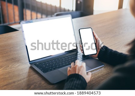 computer screen,cell phone blank mockup.hand woman work using laptop texting mobile.with white background for advertising,contact business search information on desk in cafe.marketing,design