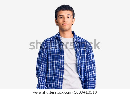 Young african amercian man wearing casual clothes looking sleepy and tired, exhausted for fatigue and hangover, lazy eyes in the morning. 