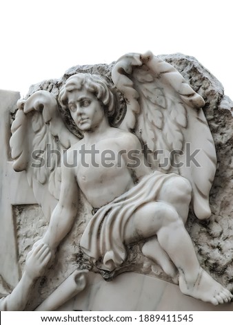 White marble gravestone with angel sculpture isolated on a white background. Selective focus