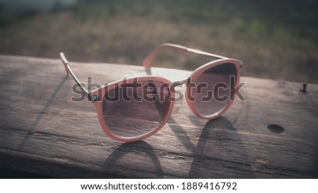 Beauty Photo: A Pinky Glasses on The Wood