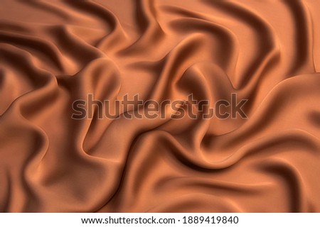 Abstract texture of natural beige or brown color fabric as concept background. Fabric texture of natural cotton or linen, silk or satin, wool or jersey textile material. Luxurious dark background. Royalty-Free Stock Photo #1889419840
