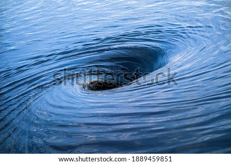 The raging whirlpool. Huge whirlpool on a water surface Royalty-Free Stock Photo #1889459851