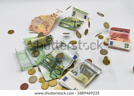 
rain of money coins and banknotes