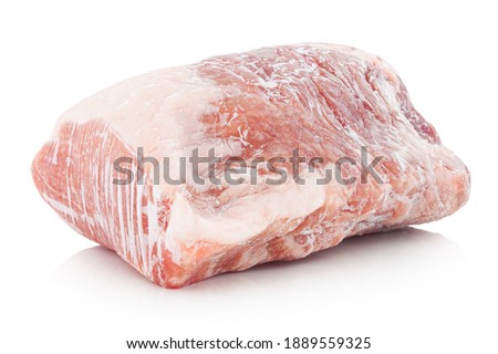 Frozen raw pork. Frozen raw meat. Isolated on white background with shadow reflection.
