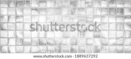 Shiny silver black and white tile wall background