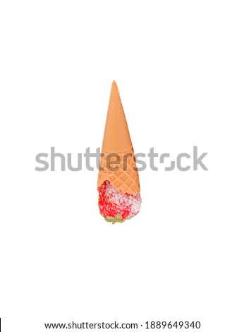Waffle cone filled with frozen strawberries. Ice cream. The concept of frozen food.