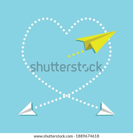 Cardboard airplanes creating heart symbol in the air. The plane passing through the heart, the cardboard plane. The plane coming out of the cabin.
